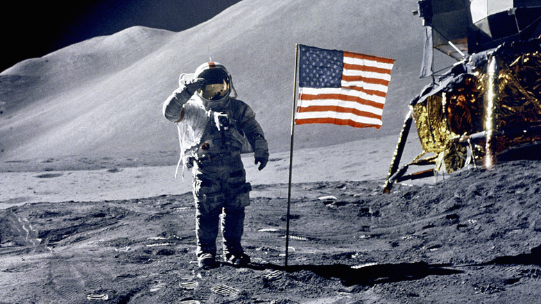 An astronaut on the moon saluting the American flag