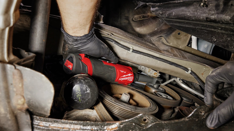 person using Makita electric ratchet